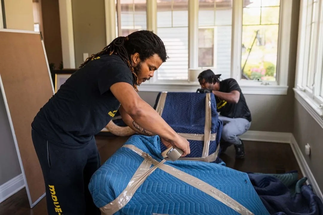 Move-tastic! movers wrapping furniture